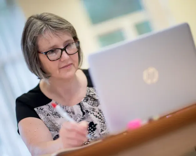 nurse sitting at laptop