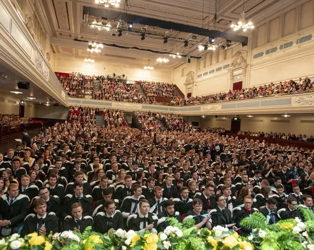 graduates sitting inside the Caird Hall