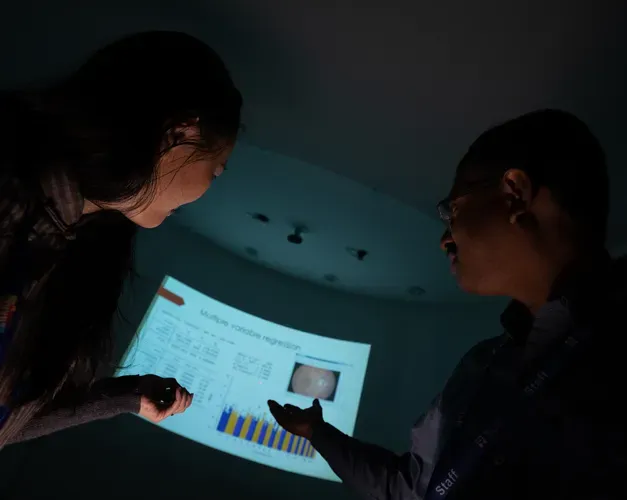 precision medicine experts looking at a screen