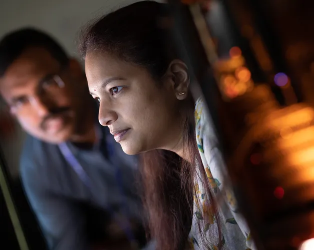 two people looking at a computer screen