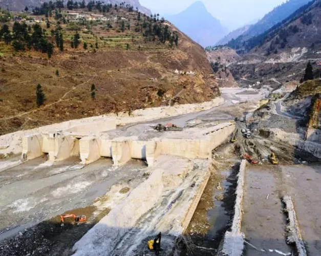 Grey rubble left from landslide - destroyed Tapovan Vishnugad hydroelectric plant