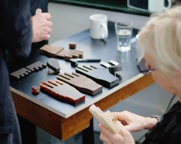 a table with wooden hands on it
