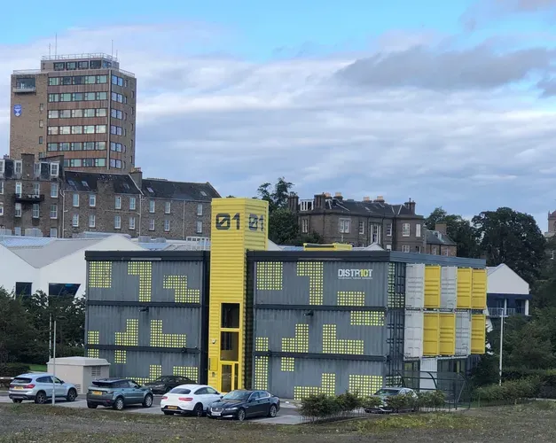 a building made out of shipping containers