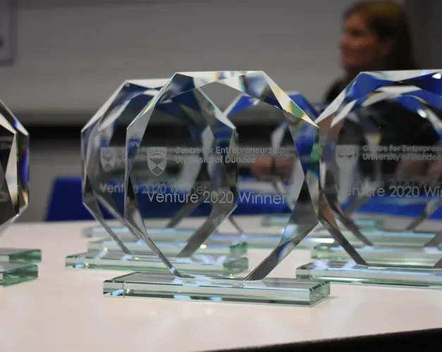 Venture glass trophies with Venture 2020 winners engraved on each one