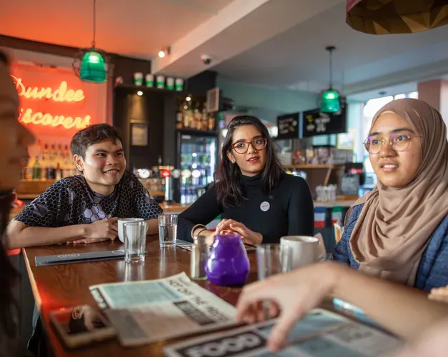 Students gathering in Pavement Cafe