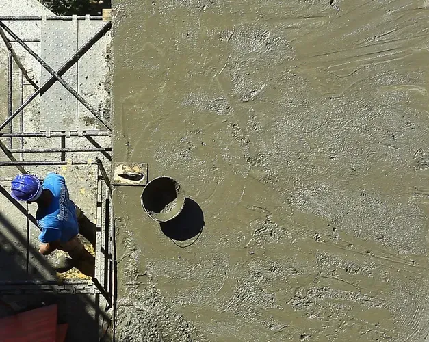 Builder next to cement