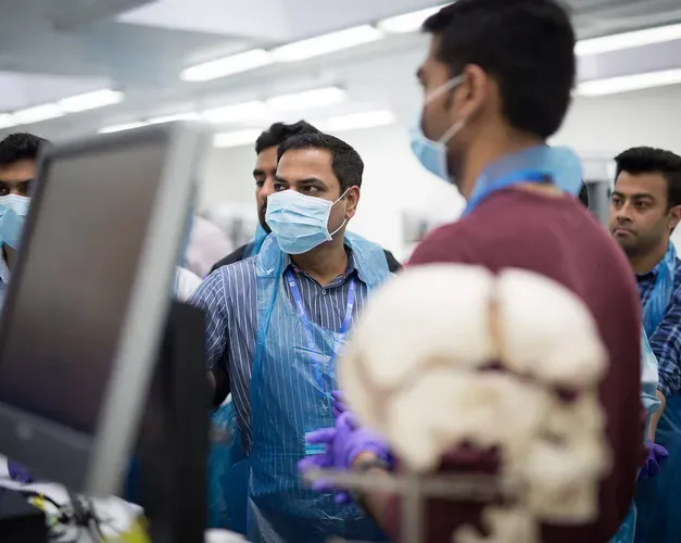 School of Medicine orthopaedic students looking at a computer screen. 