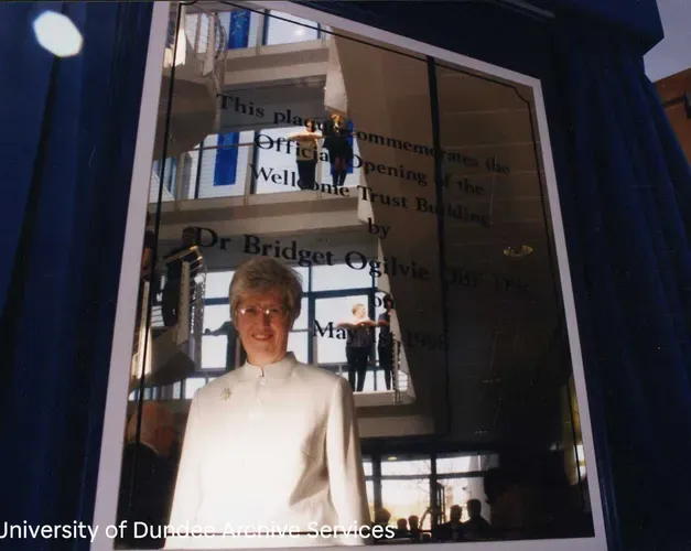Bridget Ogilvie reflected in a plaque dedicated to her.