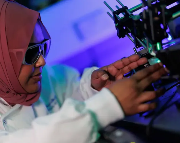 Researcher working in lab wearing protective glasses