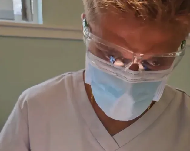 dental student working on a model head