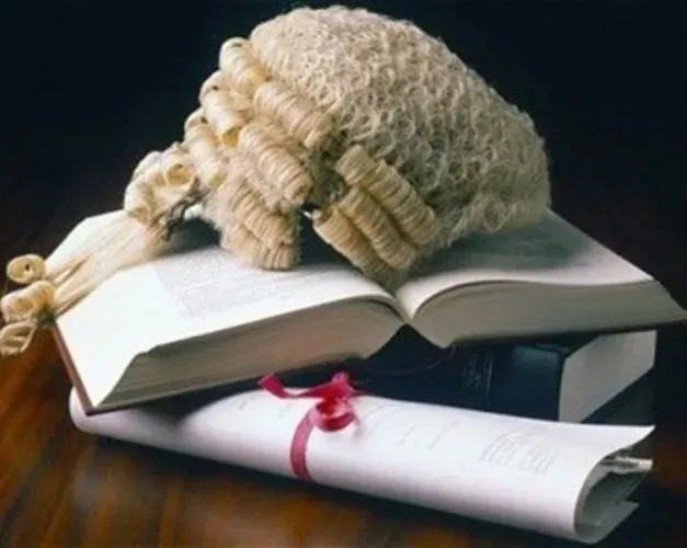 Judges wig sitting on a pile of books