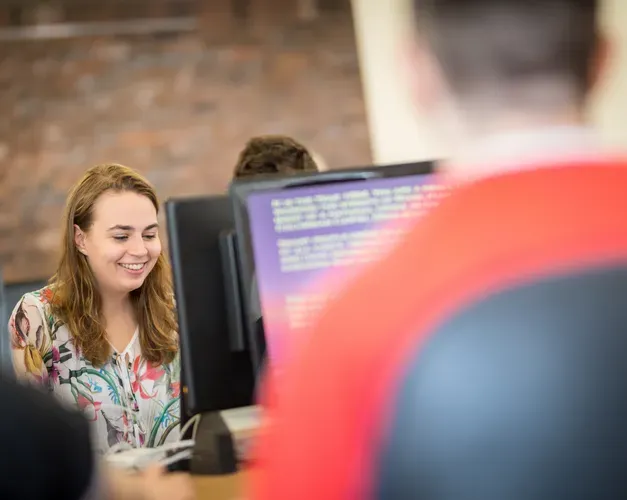 students working on computer screens