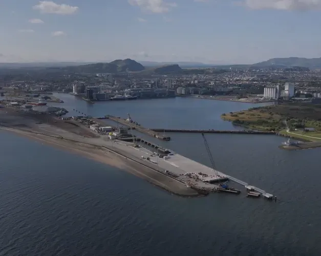 Ariel image of river and port, with city at the edge