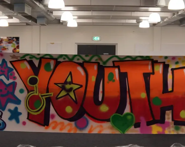 Graffiti on an outside wall, which says YOUTH