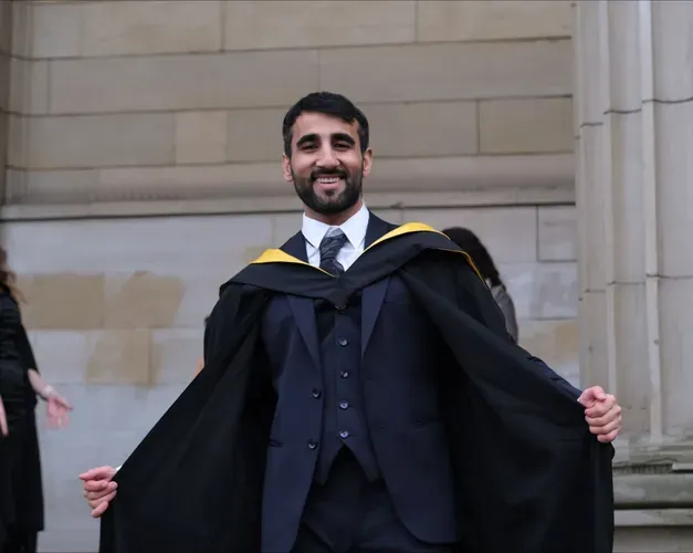 man in graduation robes