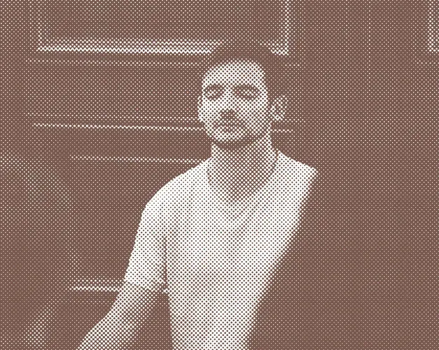 Man sitting eyes closed meditating