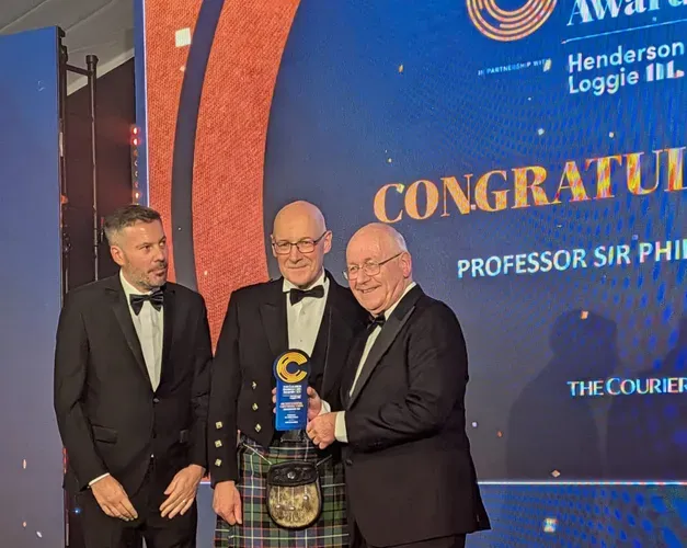 Sir Philip Cohen, with First Minister John Swinney, and The Courier editor David Clegg, all wearing formal wear, at The Courier Business Awards