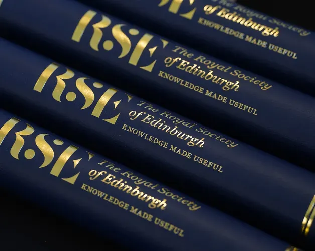 A series of naby blue scrolls with gold RSE branding