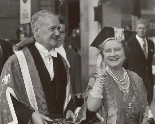 Queen Mother and the Principal wearing ceremonial robes, black and white image