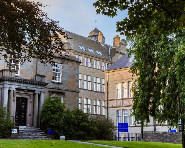An exterior shot of the School of Business building at dusk