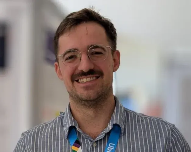 Head and shoulders shot of a man smiling