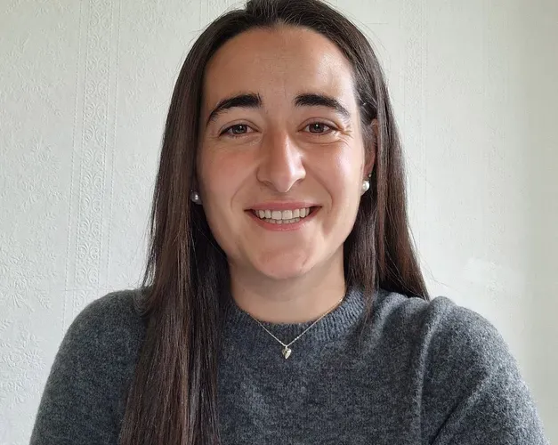 A woman smiling