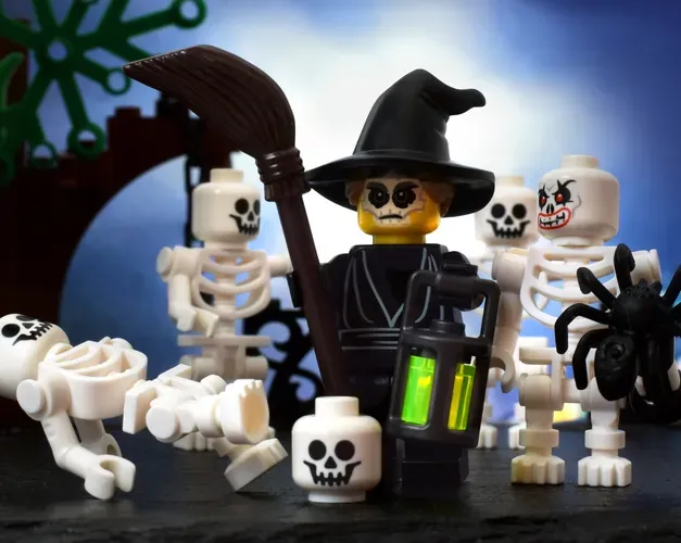 Photo showing a Lego scene comprised of a group of skeletons and a spooky looking witch