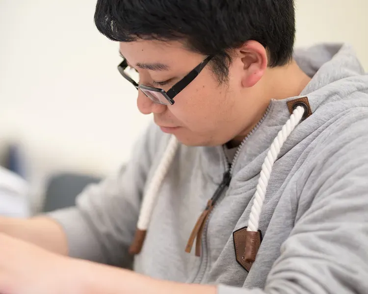 Student writing an essay