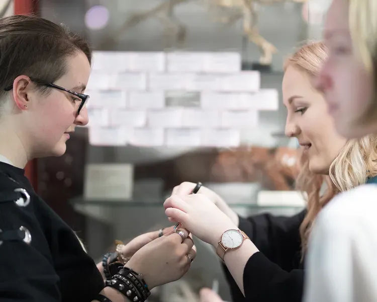 Three students knitting