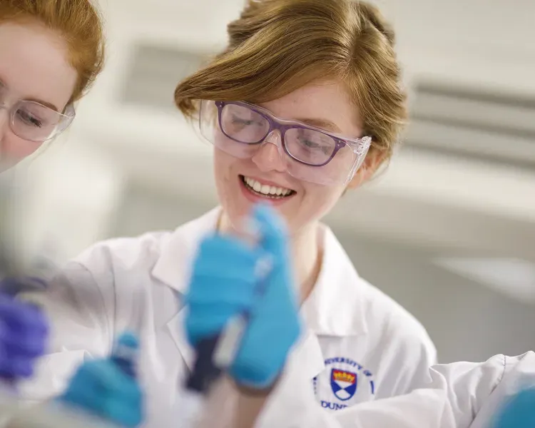 Two students working in a lab