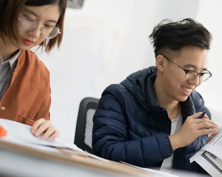 two students studying at a desk