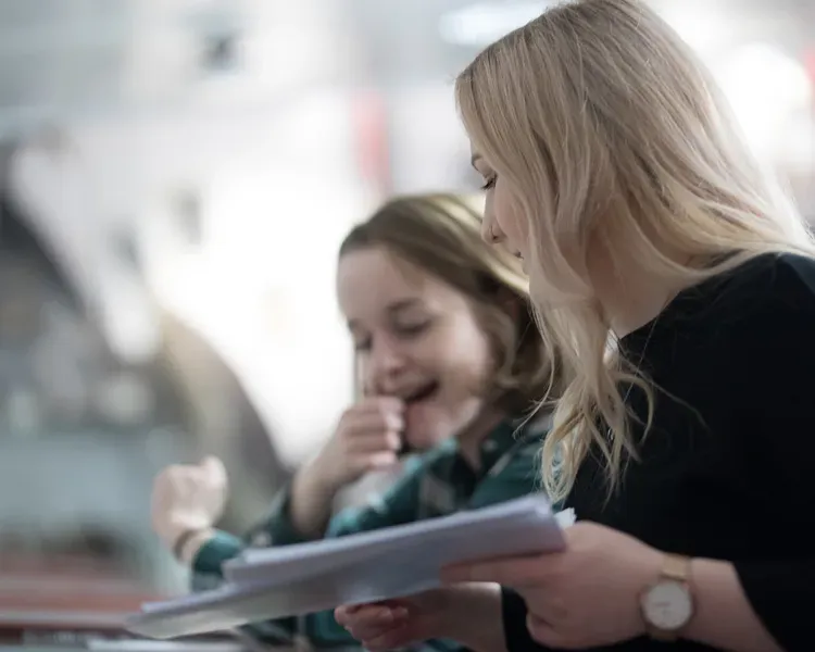 Two students laughing