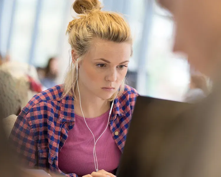 Student sitting at a laptop