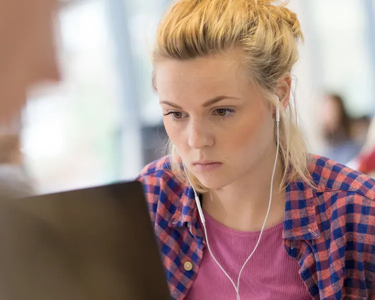 A student working on a laptop