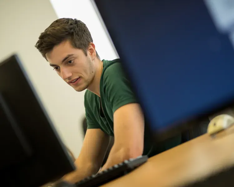 a student working at a computer