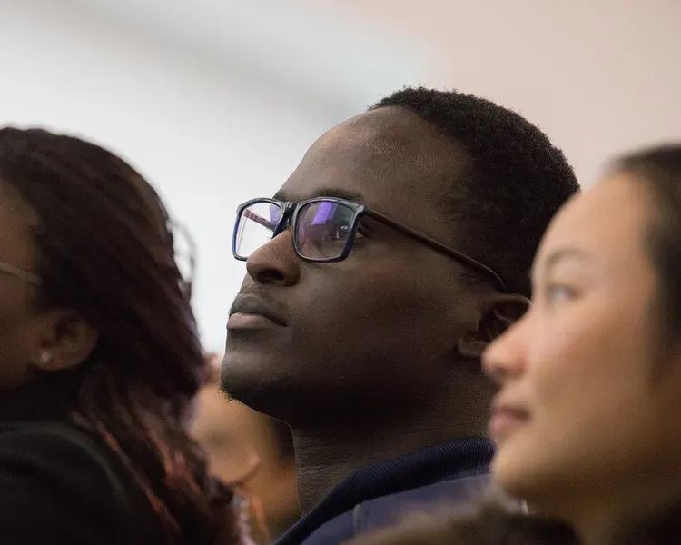 three people in a lecture theatre