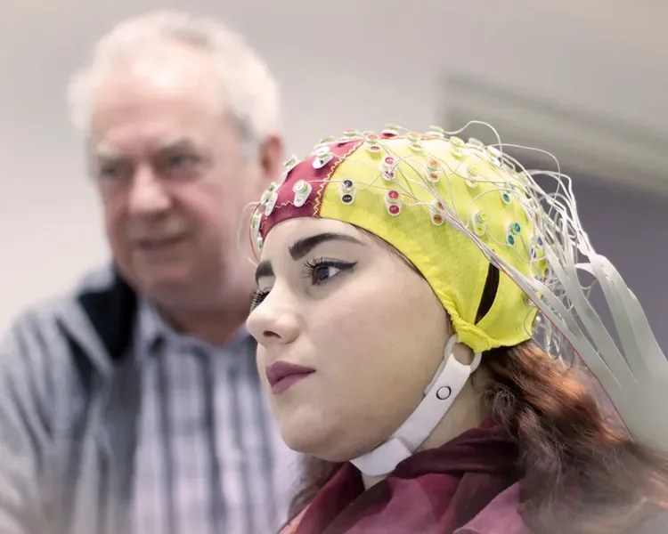 Woman wearing brain imaging cap