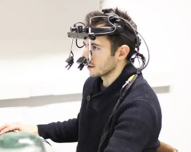 Boy wearing eyetracking equipment