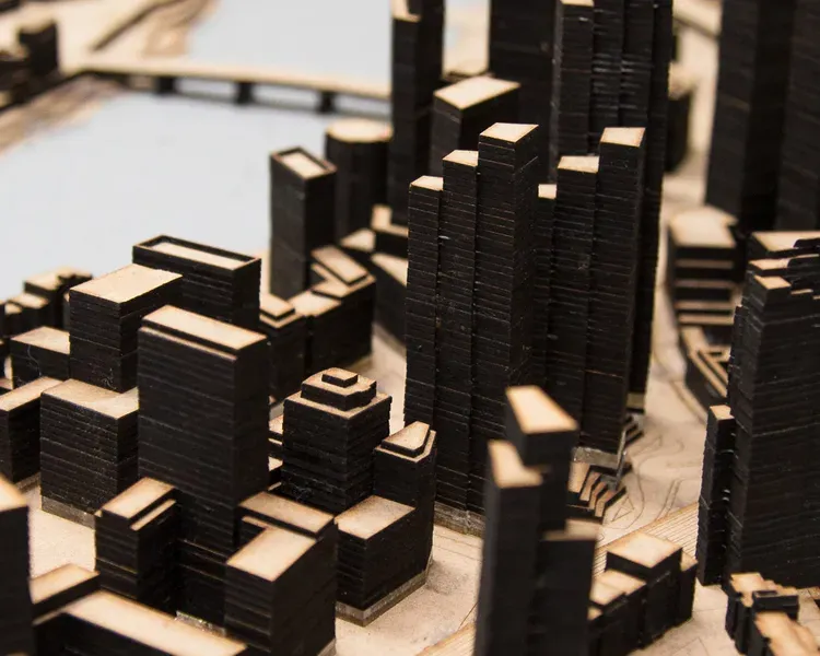 a cardboard architectural model of a city