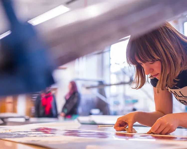student using the printmaking facilities