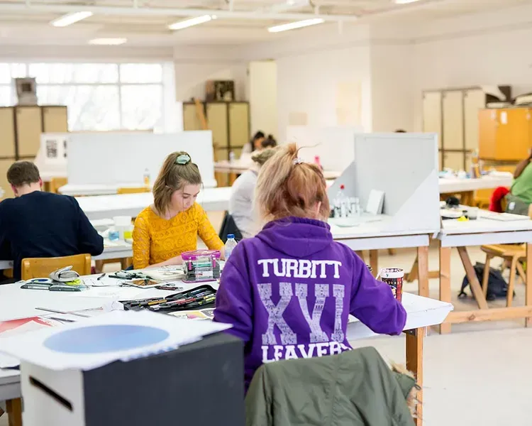 Students working in bright and spacious studio