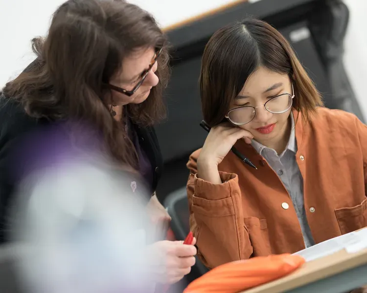 Two women working together