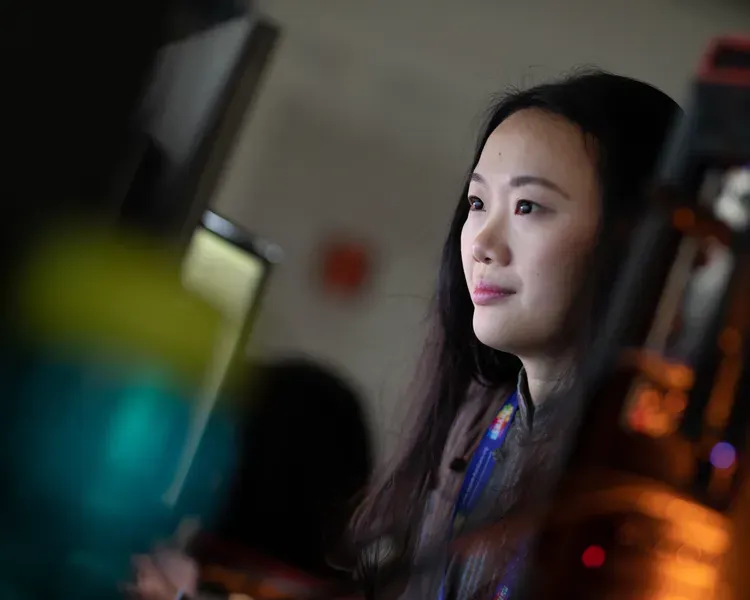 Photograph of Yvonne with lab equipment in front of her