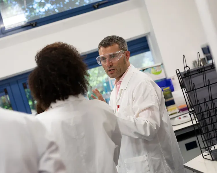 Professor Alessio Ciulli in a lab with researchers
