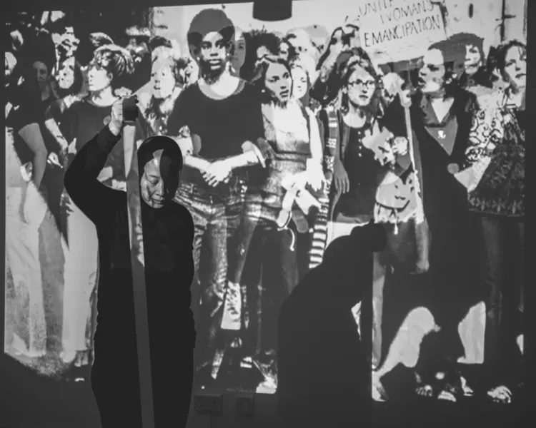 black and white image of people and clothes