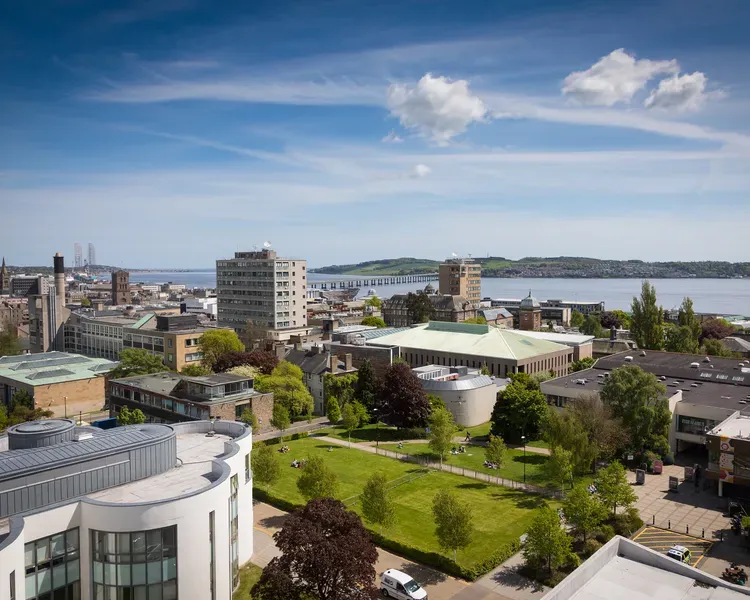 Campus green showing several of the city campus buildings