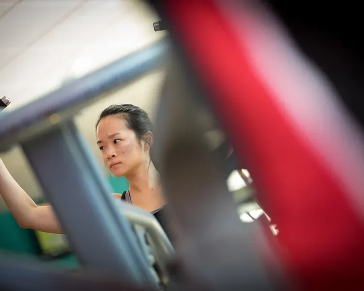 Student using the weight training facilities at ISE