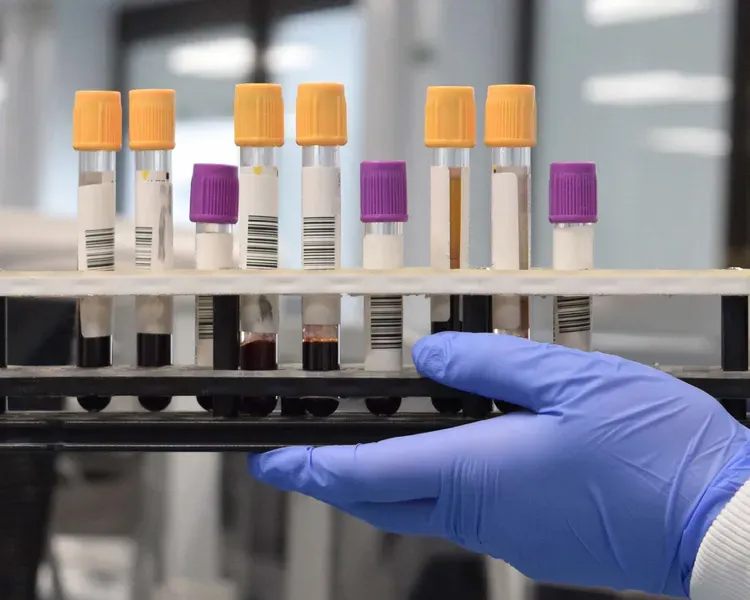 Researcher holding test tubes