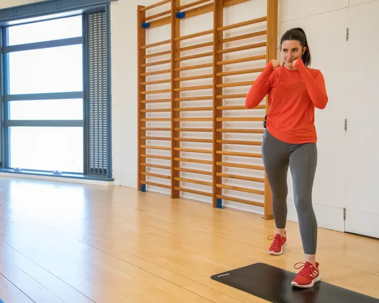 An instructor leads an exercise class