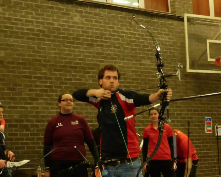 student with a bow and arrow